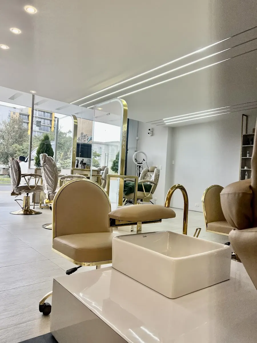 ALDORA's nail area with natural light and gold finishes
